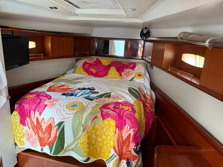Passion Place Yacht Photos Pics Cozy cabin interior of 2007 Beneteau 49 with vibrant floral bedding.