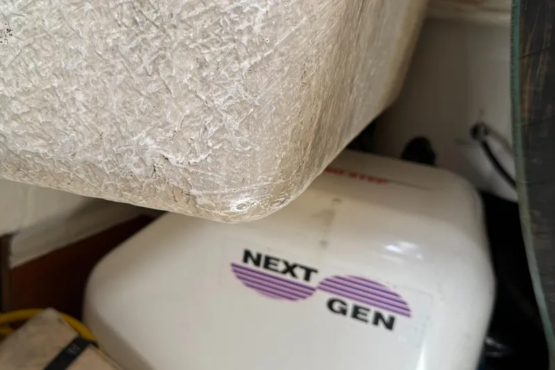 Passion Place Yacht Photos Pics Close-up of a 2007 Beneteau 49 boat's engine compartment with "Next Gen" generator.