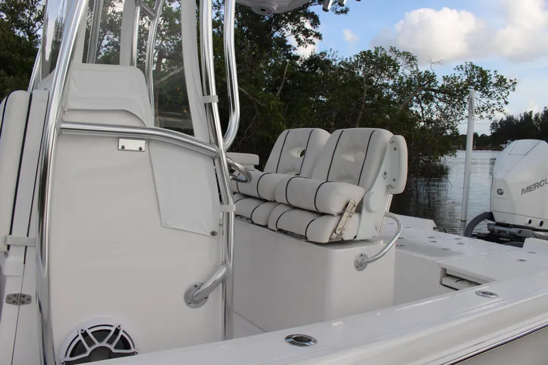  Yacht Photos Pics 2023 Contender 26 Bay boat interior with cushioned seating and sleek design.