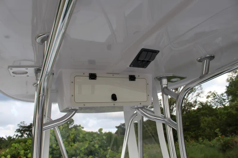  Yacht Photos Pics 2023 Contender 26 Bay boat T-top with storage compartment and rod holders.