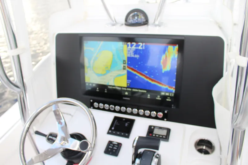  Yacht Photos Pics 2023 Contender 26 Bay boat dashboard with navigation and control systems.