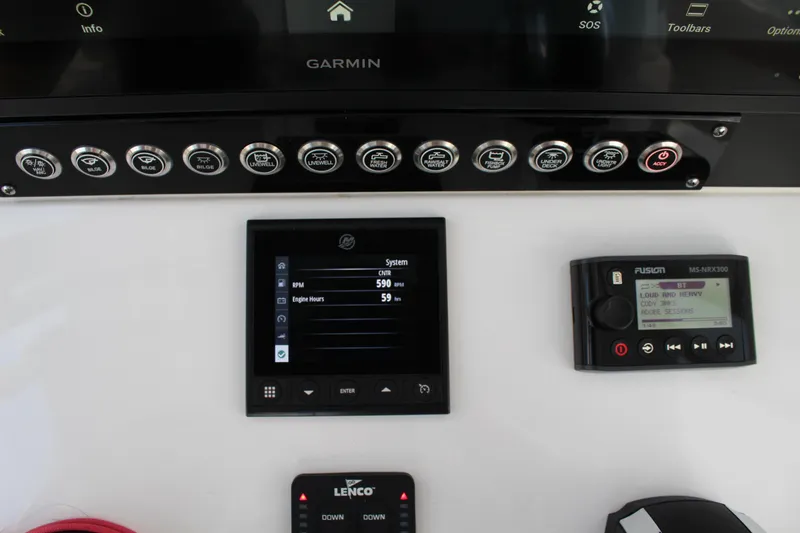  Yacht Photos Pics 2023 Contender 26 Bay boat dashboard with Garmin and Lenco controls.
