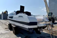 Custom 2023 Limo Tender boat on dry dock, showcasing sleek design and modern features.