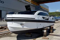 Custom 2023 Limo Tender yacht on dry dock, showcasing sleek design and modern features.