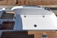 Custom 2023 Limo Tender boat deck with sleek white and wood design.