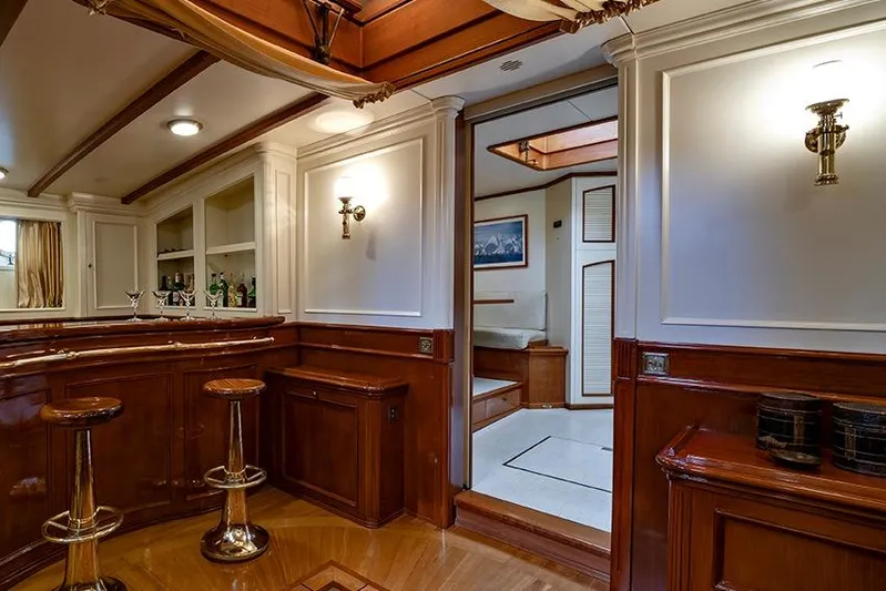 Invader Yacht Photos Pics Luxurious interior of 1905 Gaff Schooner by G. LAWLEY & Son, featuring elegant wood finishes.