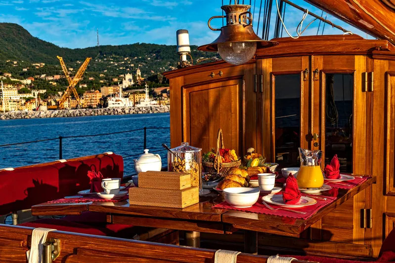 Invader Yacht Photos Pics Luxurious breakfast setup on a 1905 Gaff Schooner by G. LAWLEY & Son Corporation.