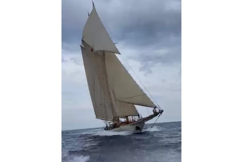 Invader Yacht Photos Pics Historic 1905 Gaff Schooner by G. LAWLEY & Son Corporation sailing on open sea.