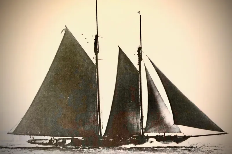 Invader Yacht Photos Pics Vintage 1905 Gaff Schooner by G. LAWLEY & Son Corporation sailing on open water.