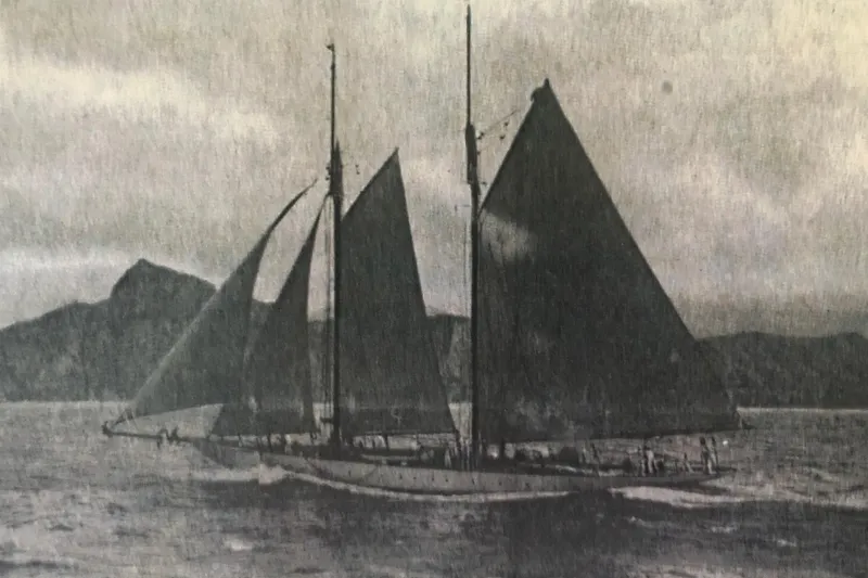 Invader Yacht Photos Pics Vintage 1905 Gaff Schooner by G. LAWLEY & Son Corporation sailing on open waters.