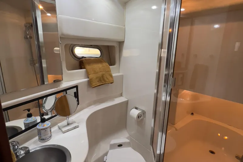  Yacht Photos Pics Bathroom interior of 1999 Bayliner 3988 Command Bridge Motoryacht with shower and sink.