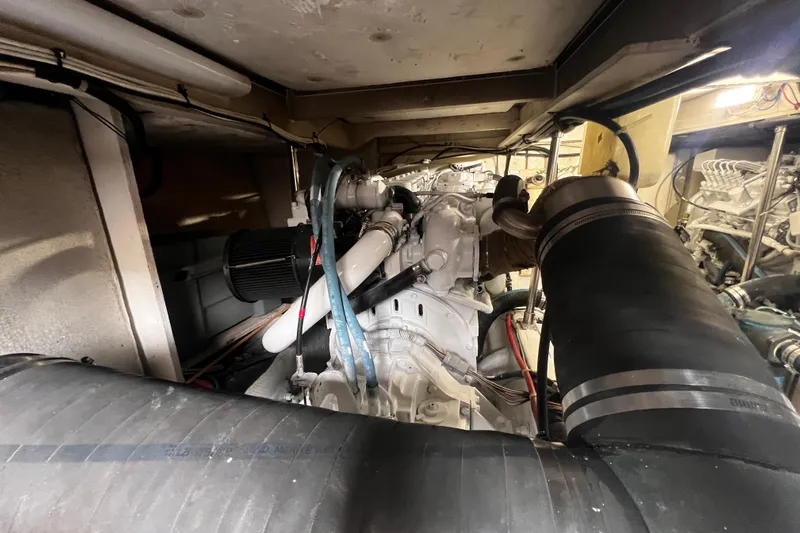  Yacht Photos Pics Engine room of 1999 Bayliner 3988 Command Bridge Motoryacht, showcasing mechanical components.