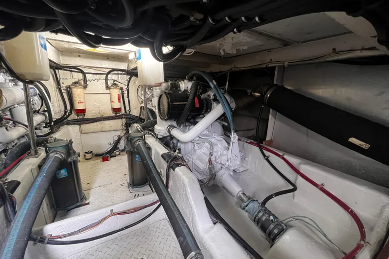  Yacht Photos Pics Engine room of 1999 Bayliner 3988 Command Bridge Motoryacht, showcasing mechanical components and systems.