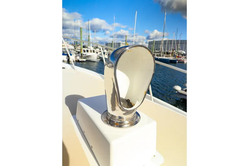  Yacht Photos Pics Chrome boat fitting on 2005 New England Boatworks Downeast Sedan, docked at marina.