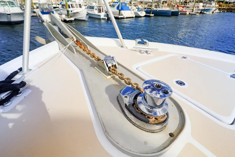  Yacht Photos Pics 2005 New England Boatworks Downeast Sedan anchor chain and winch on deck.