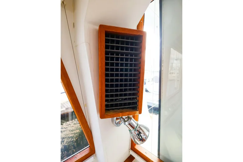  Yacht Photos Pics Wooden vent and light fixture inside 2005 New England Boatworks Downeast Sedan.