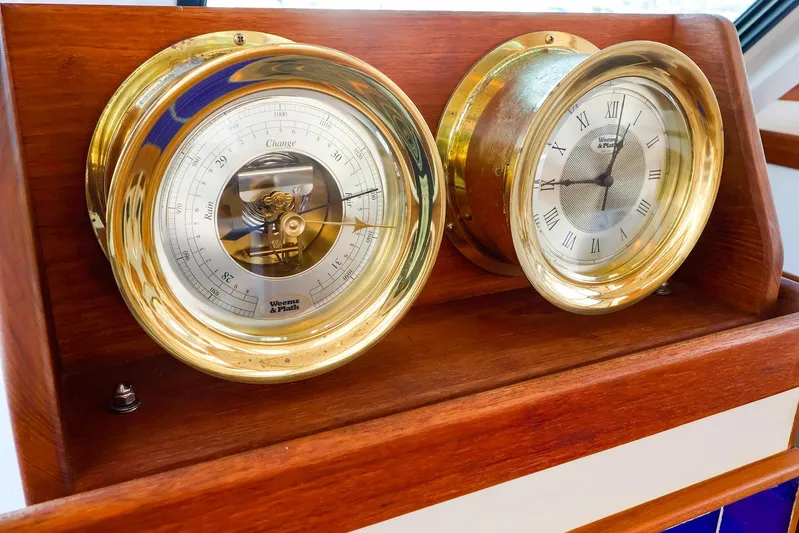  Yacht Photos Pics Brass barometer and clock on 2005 New England Boatworks Downeast Sedan.