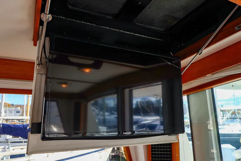  Yacht Photos Pics Flat-screen TV inside 2005 New England Boatworks Downeast Sedan yacht interior.