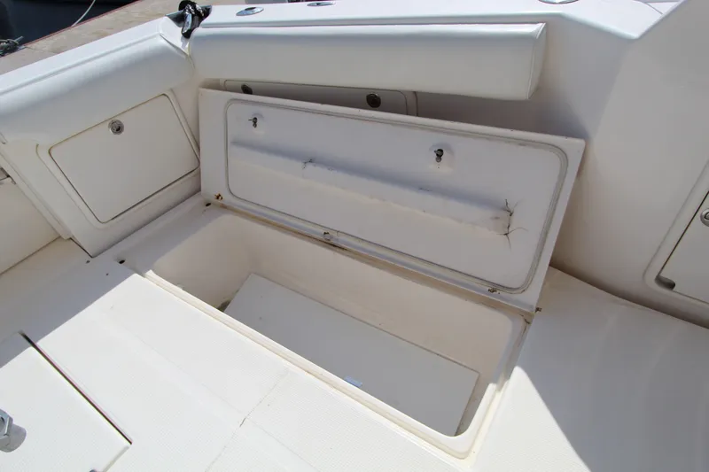  Yacht Photos Pics Open storage compartment on 2005 Riviera 46 Convertible Sportfisher boat deck.
