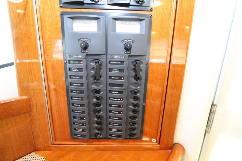  Yacht Photos Pics Electrical panel on 2005 Riviera 46 Convertible Sportfisher, featuring switches and meters.