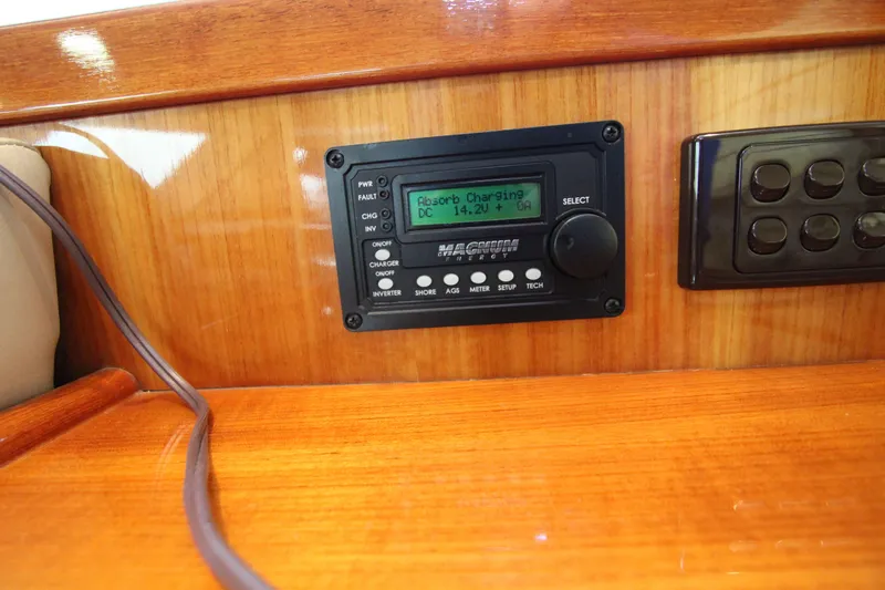  Yacht Photos Pics Control panel on 2005 Riviera 46 Convertible Sportfisher boat, displaying charging status.