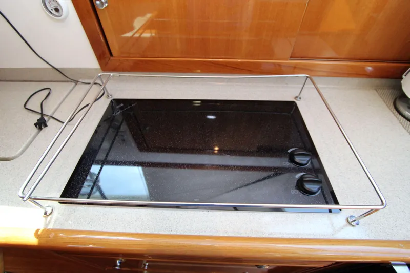  Yacht Photos Pics Stovetop on 2005 Riviera 46 Convertible Sportfisher yacht, featuring sleek design and modern controls.