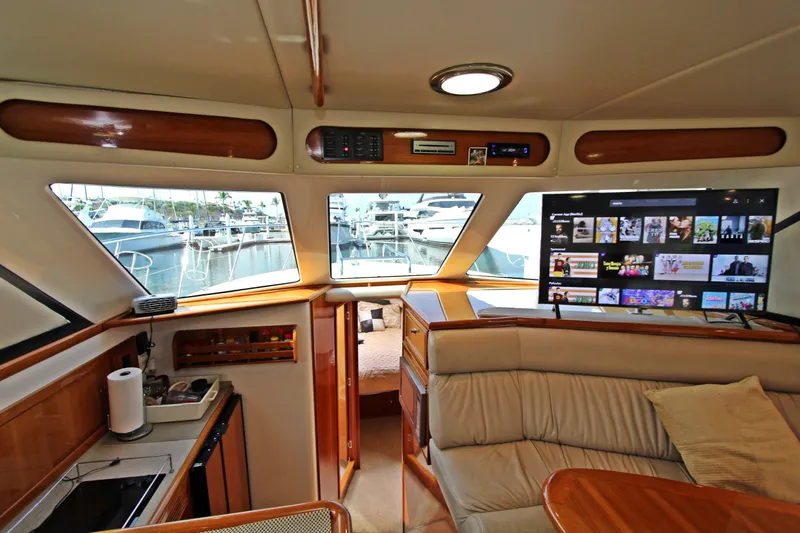  Yacht Photos Pics Interior of 2005 Riviera 46 Convertible Sportfisher yacht with modern amenities and marina view.