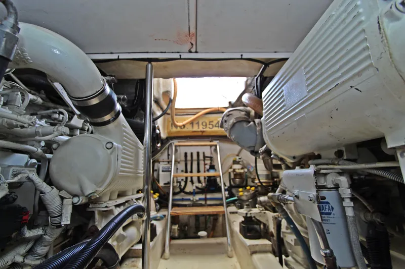  Yacht Photos Pics Engine room of 2005 Riviera 46 Convertible Sportfisher, showcasing mechanical components and systems.