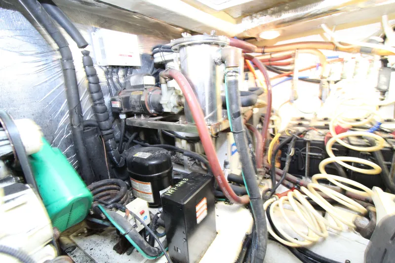  Yacht Photos Pics Engine room of 2005 Riviera 46 Convertible Sportfisher with various mechanical components.