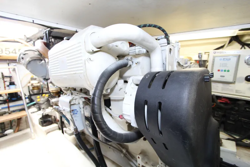  Yacht Photos Pics Engine room of 2005 Riviera 46 Convertible Sportfisher, showcasing detailed machinery components.