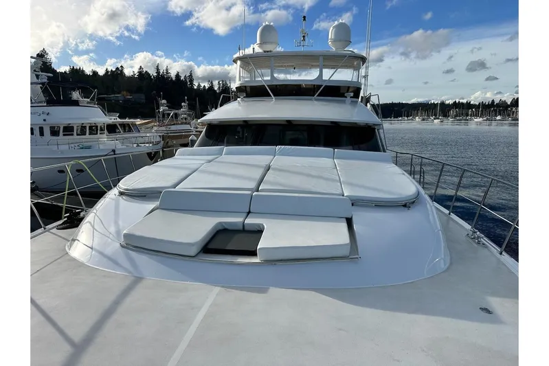 First Home Yacht Photos Pics 1988 Cheoy Lee 92 yacht with sunbathing deck, docked at marina under blue sky.