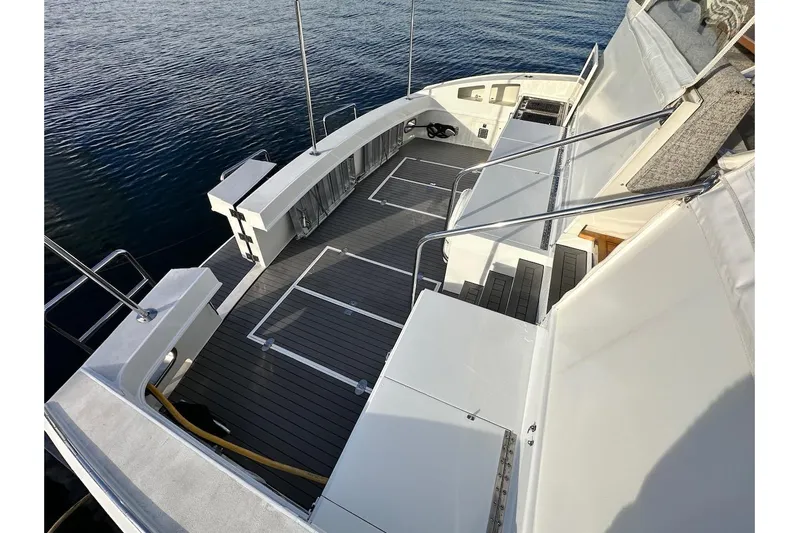 First Home Yacht Photos Pics 1988 Cheoy Lee 92 yacht deck with sleek design and spacious layout.