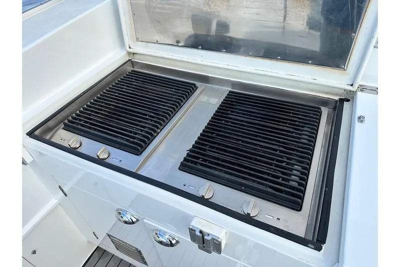 First Home Yacht Photos Pics Outdoor grill on 1988 Cheoy Lee 92 yacht, featuring dual burners and stainless steel finish.