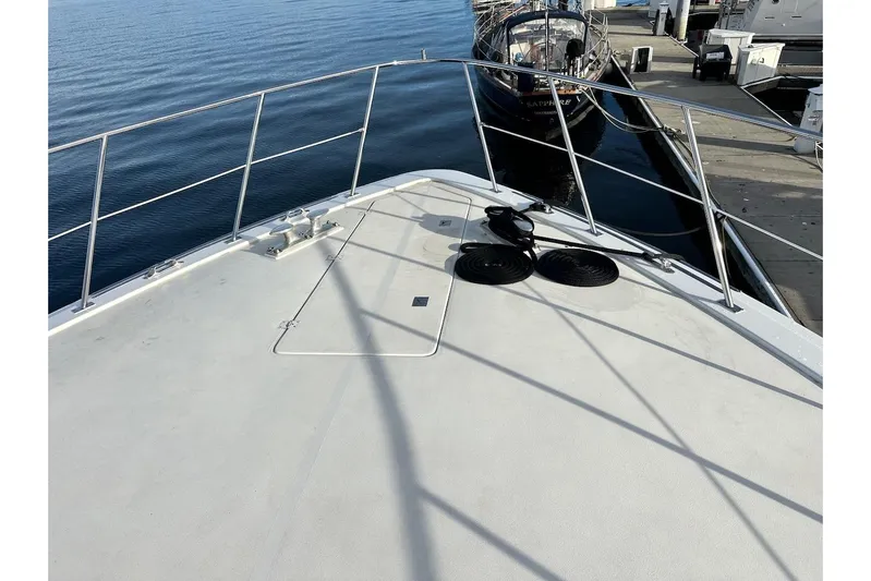 First Home Yacht Photos Pics Bow view of 1988 Cheoy Lee 92 yacht docked at marina.