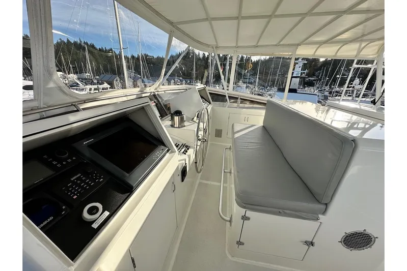 First Home Yacht Photos Pics Cockpit of 1988 Cheoy Lee 92 yacht with navigation equipment and seating.