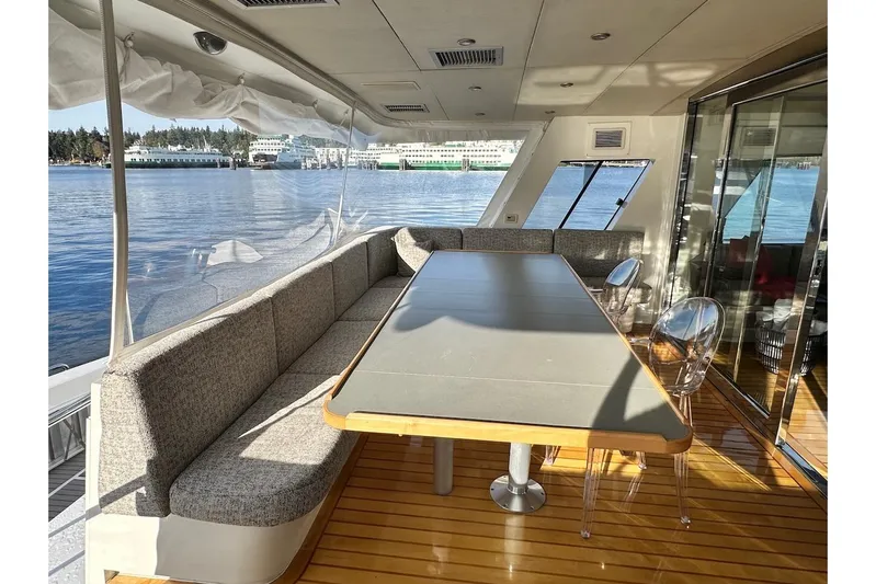 First Home Yacht Photos Pics Luxurious 1988 Cheoy Lee 92 yacht interior with elegant dining area and scenic water views.