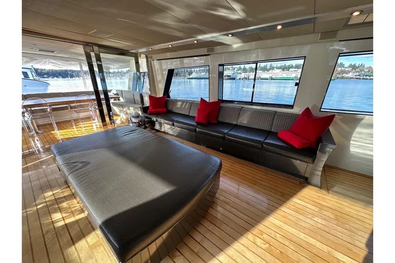 First Home Yacht Photos Pics Luxurious interior of 1988 Cheoy Lee 92 yacht with elegant seating and scenic water views.