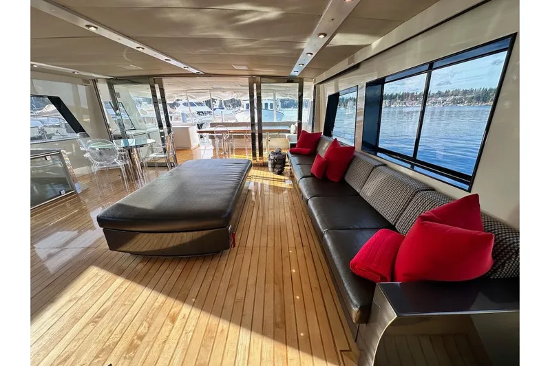 First Home Yacht Photos Pics Luxurious interior of 1988 Cheoy Lee 92 yacht with elegant seating and scenic windows.