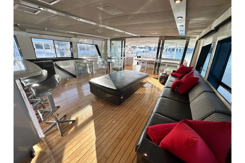 First Home Yacht Photos Pics Luxurious interior of 1988 Cheoy Lee 92 yacht with modern seating and elegant decor.