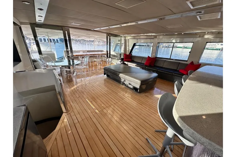 First Home Yacht Photos Pics Luxurious 1988 Cheoy Lee 92 yacht interior with elegant seating and panoramic windows.