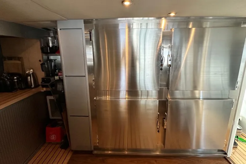 First Home Yacht Photos Pics Stainless steel kitchen appliances on a 1988 Cheoy Lee 92 yacht.