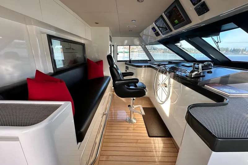 First Home Yacht Photos Pics Luxurious helm of 1988 Cheoy Lee 92 yacht with modern controls and seating.