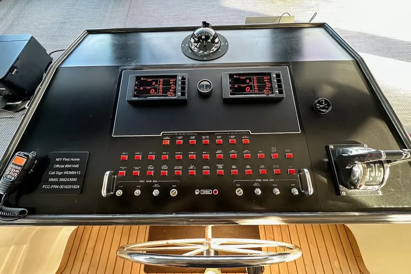 First Home Yacht Photos Pics Control panel of a 1988 Cheoy Lee 92 yacht with navigation instruments and switches.