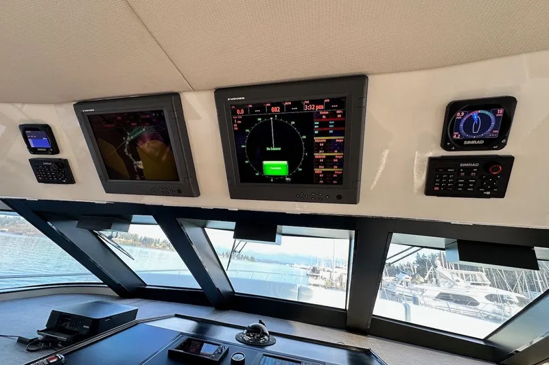 First Home Yacht Photos Pics Bridge of 1988 Cheoy Lee 92 yacht with navigation displays and controls.