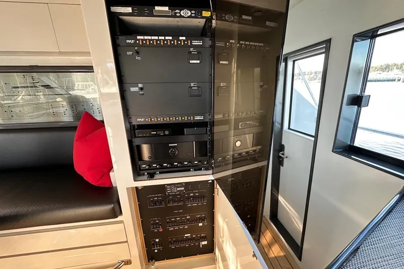 First Home Yacht Photos Pics Interior view of 1988 Cheoy Lee 92 yacht with control panels and seating area.