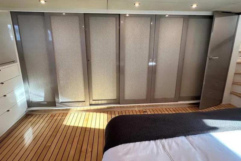 First Home Yacht Photos Pics Luxurious interior of 1988 Cheoy Lee 92 yacht with wooden flooring and modern design.