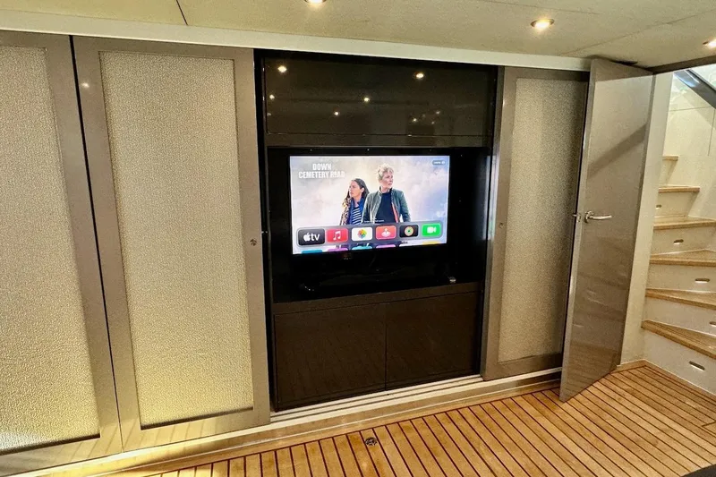 First Home Yacht Photos Pics Luxurious interior of 1988 Cheoy Lee 92 yacht with modern entertainment system.