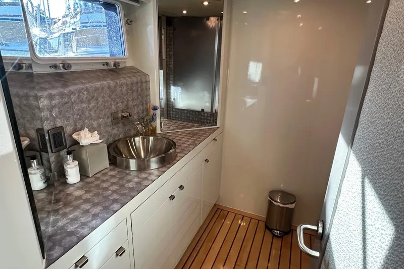 First Home Yacht Photos Pics Luxurious bathroom interior of 1988 Cheoy Lee 92 yacht with modern fixtures.