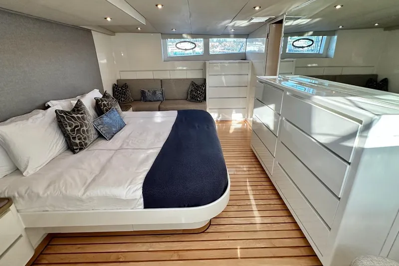 First Home Yacht Photos Pics Luxurious bedroom interior of 1988 Cheoy Lee 92 yacht with modern furnishings.