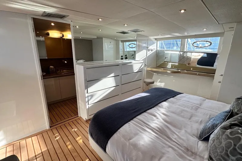 First Home Yacht Photos Pics Luxurious interior of 1988 Cheoy Lee 92 yacht with modern bedroom and bathroom.